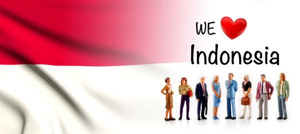 we love Indonesia, A group of people pose next to the Indonesian flag.