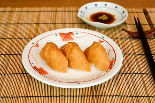 Inari sushi, deep fried tofu filled with rice (Japanese food)