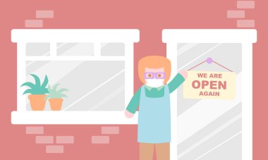 Covid-19 pandemi sırasında bir adam dükkanını yeniden açıyor.