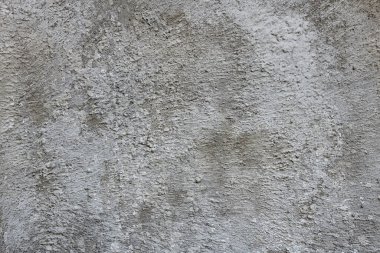Bina duvarındaki gri ham betonun dokusuna yakın çekim.