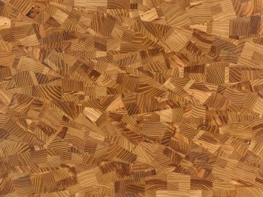 Soyut desenli çeşitli ahşaplardan yapılmış bir kesme tahtasının yakın çekimi.. 