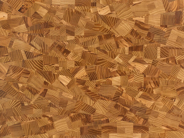 Крупный план разделочной доски из древесины различных пород древесины с абстрактным рисунком
. 