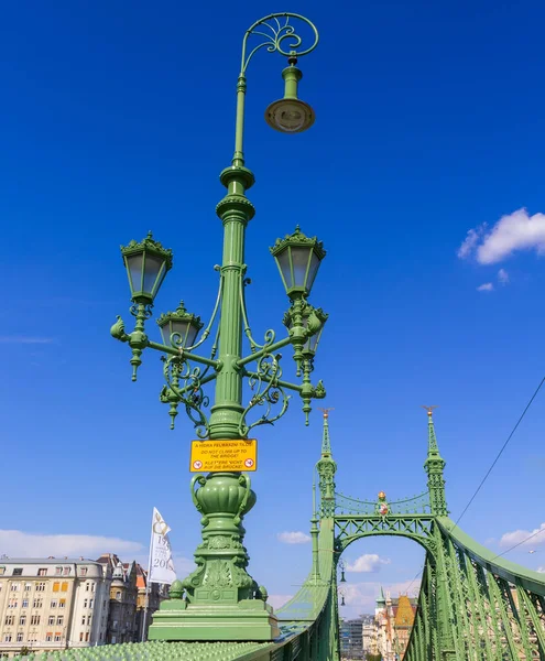 Bright sunny day, a lantern on the Liberty Bridge in Hungary. Budapest