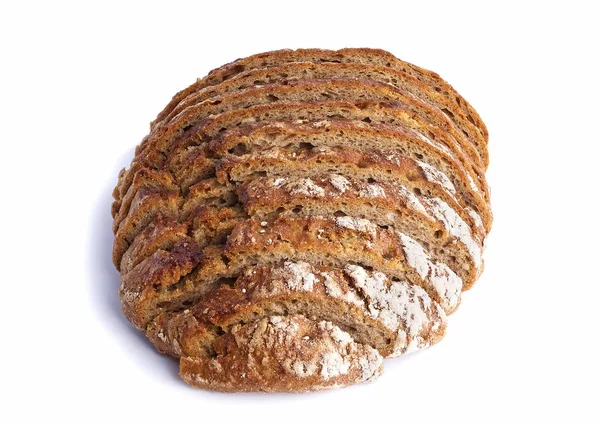 Pão escuro fatiado em um fundo branco — Fotografia de Stock