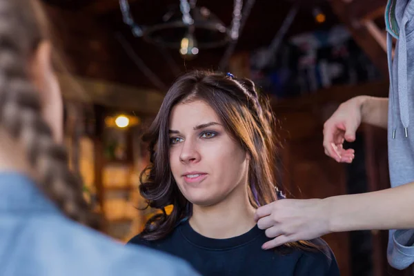 Make-up artist and hairdresser working with woman client — Stock Photo, Image