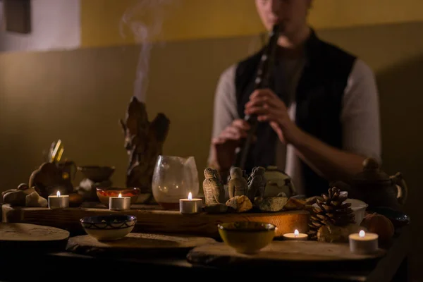 Man playing japanese bamboo flute - shakuhachi