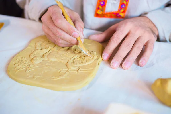 Potter making clay stamp picture — Stock Photo, Image