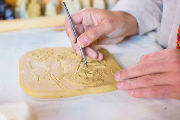 Potter making clay stamp picture — Stock Photo, Image