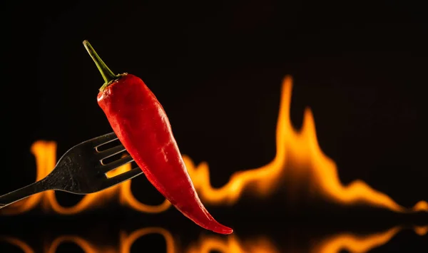 Chili green pepper red with fire