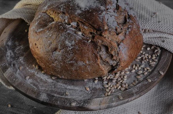 still life on the subject of bread, grain, milk.