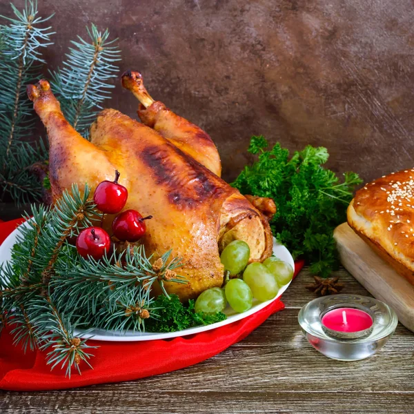 Traditional dish turkey on the holiday table. Festive dinner for Thanksgiving or Christmas.