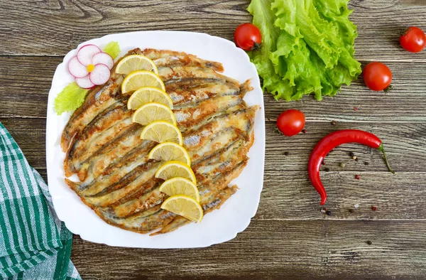 Baked Capelin White Plate Wooden Table Dish Small Fish Top — Stock Photo, Image