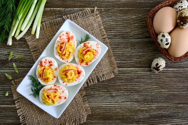 stock image Deviled eggs. Delicious appetizer. Boiled eggs stuffed with yolk, mustard, mayonnaise, paprika. Classic recipe. The top view