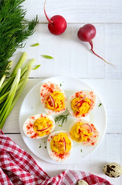 Deviled eggs. Delicious appetizer. Boiled eggs stuffed with yolk, mustard, mayonnaise, paprika. Classic recipe. The top view