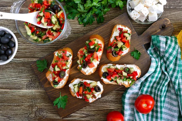 Delicious Bruschettas Goat Cheese Fresh Vegetables Crispy Baguette Slices Feta — Stock Photo, Image