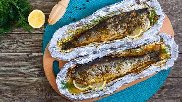 Baked Herring Lemon Spices Foil Wooden Table Tasty Fish Dish — Stock Photo, Image