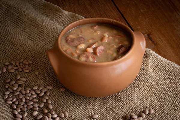 Feijoada. Typical Brazilian food. Rustic wood background