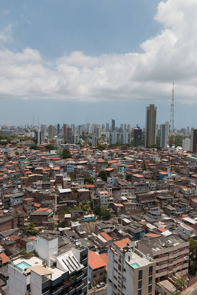 Urban social contrast. Buildings and slum. Inequality