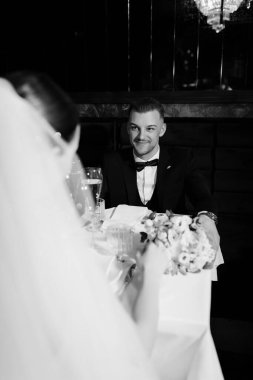 Couple enjoys intimate dinner at elegant venue during special celebration night