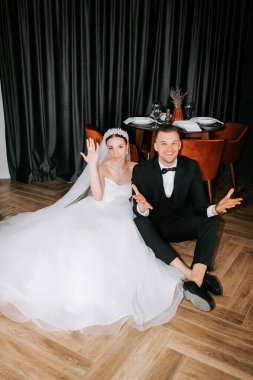 Couple celebrates at their wedding reception with joy and elegance in a modern venue