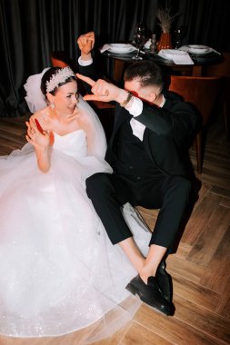 Joyful couple celebrating their wedding on the dance floor at an elegant reception venue