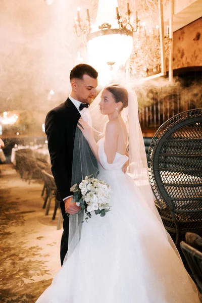 Couple celebrates romantic moment in a beautiful venue during their wedding ceremony