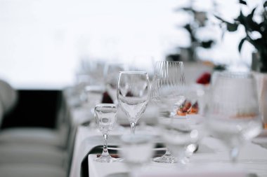 Elegant table setting with shining glassware for a special event in a bright venue