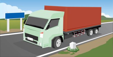 Konteynır kamyonları uzun mesafeli ulaşım için şehrin dışındaki geniş çim tarlalarından geçiyor..