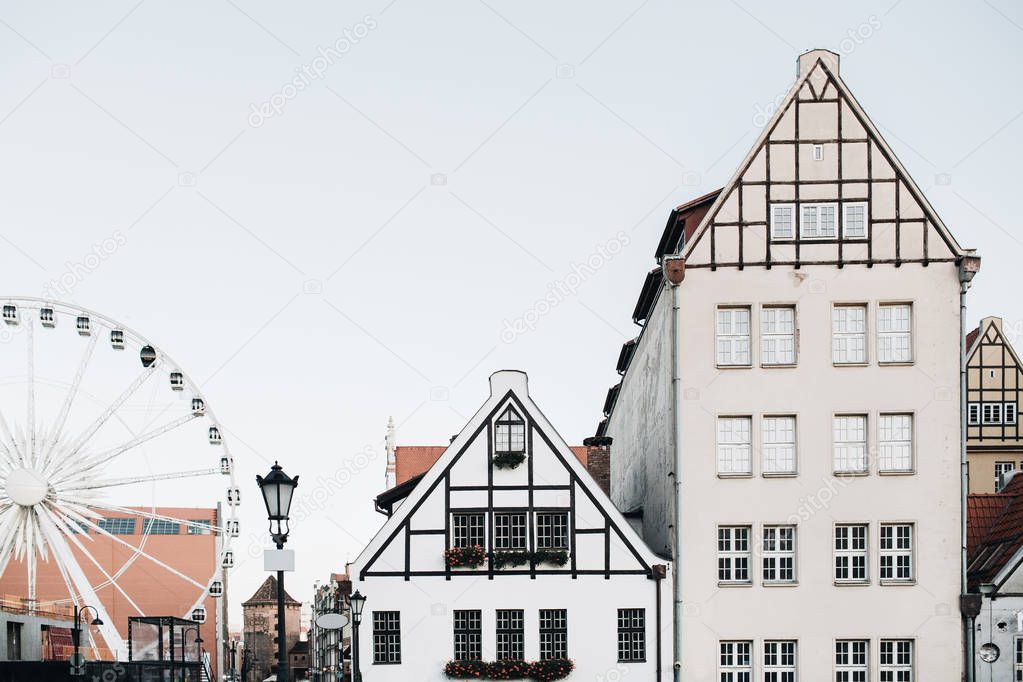View of buildings in Old Town of Gdansk, Poland. Architecture of Eastern Europe. Ferris and cute traditional houses.