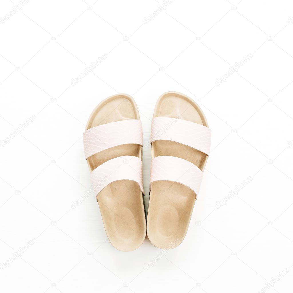 Female slippers isolated on white background. Flat lay, top view minimal fashion concept.