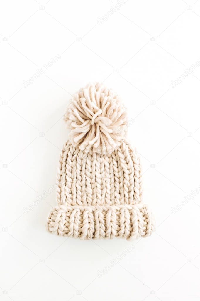 Warm female knitted hat isolated on white background. Flat lay, top view minimal fashion concept.