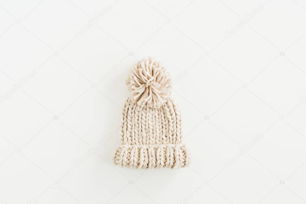 Warm knitted hat isolated on white background. Flat lay, top view.