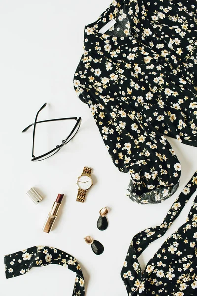 Fashion flatlay of modern female clothes and accessories on white background. Flat lay, top view.