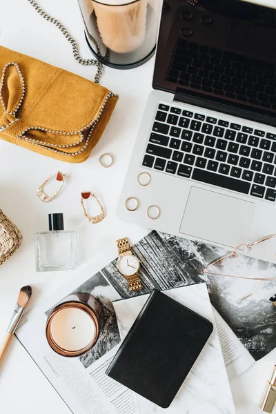 Home office desk workspace with laptop, accessories on white background. Flat lay, top view.