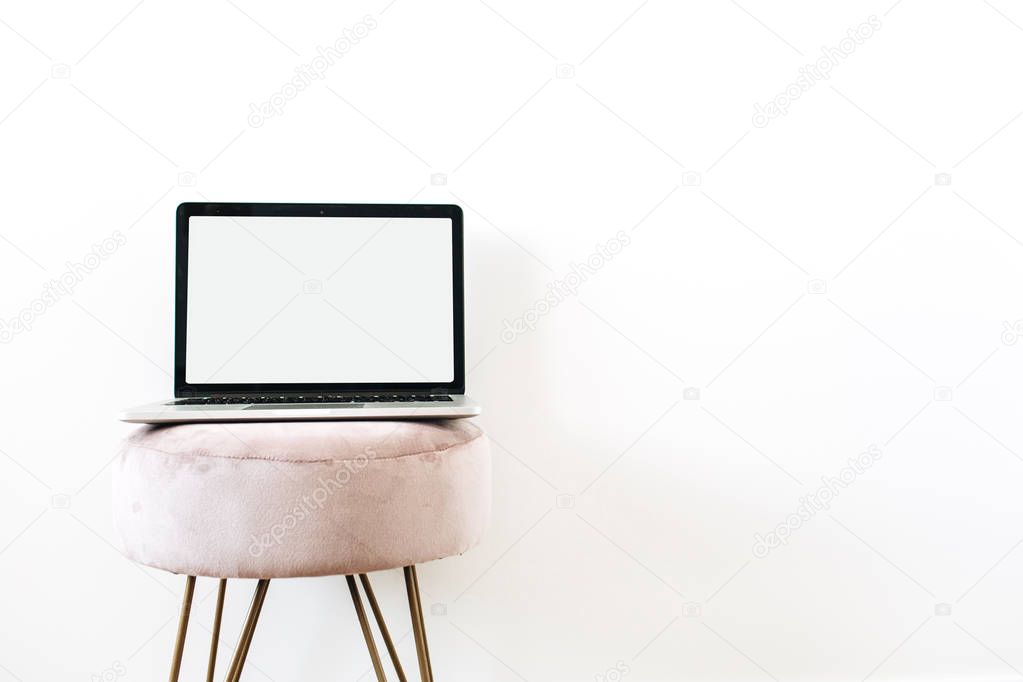 Copy space mockup screen laptop on stylish stool on white background. Minimalist blog, website, social media hero header.