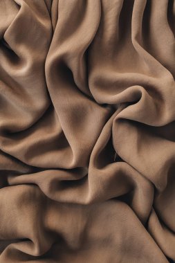 Kahverengi ipek buruşuk keten battaniye doku deseni. Yakın çekim tekstil arka plan.