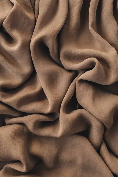 Kahverengi ipek buruşuk keten battaniye doku deseni. Yakın çekim tekstil arka plan.