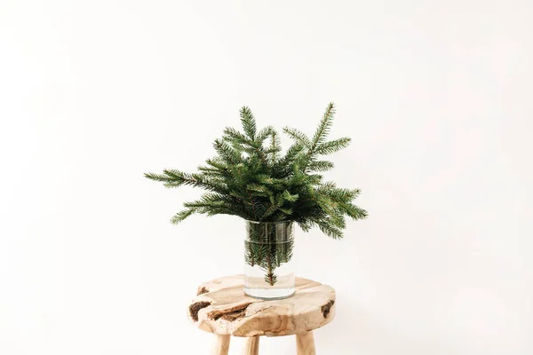 Bouquet Fir Tree Branches Solid Wooden Stool White Background Minimal — Stock Photo, Image