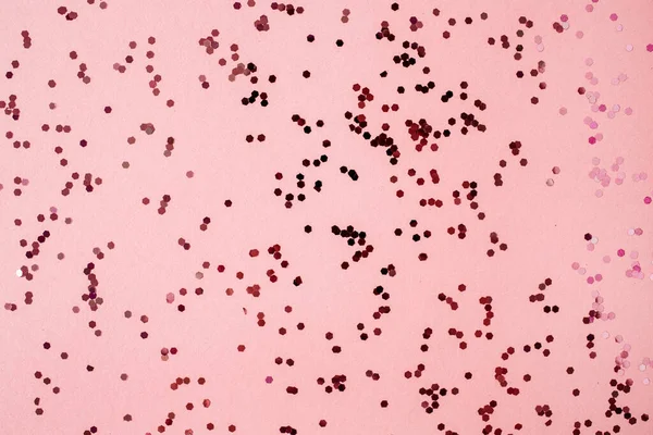 カラフルなピンク 赤い輝くコンフェッティの背景 休日のコンセプト — ストック写真