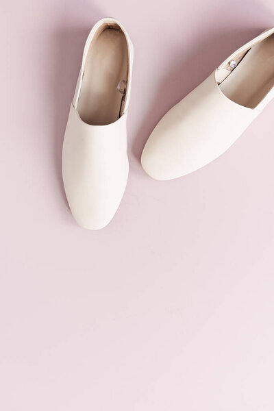 Fashion collage with women's white leather slippers on pink. Flat lay, top view lifestyle concept.