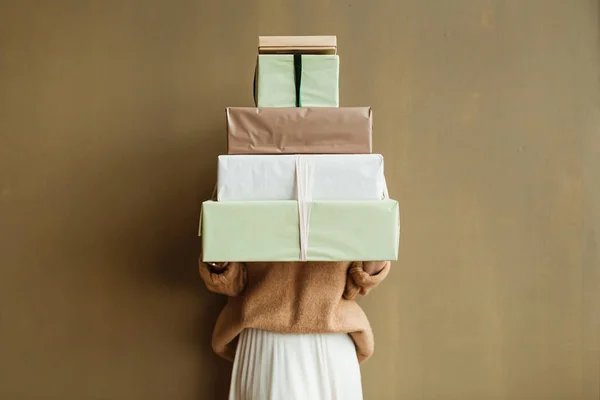 Young Beautiful Woman Hold Paper Gift Boxes Stack Olive Wall — Stock Photo, Image
