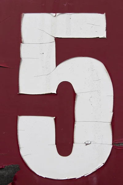number five painted on grungy surface, number 5, five, old sticker number on board