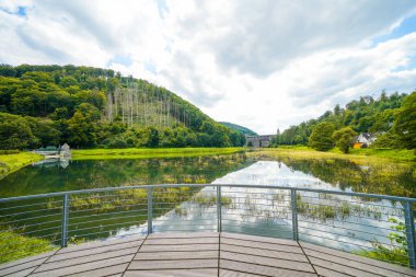 Reservoir on the dam wall at Diemelsee and the surrounding landscape. Nature at the Diemel Dam in the Sauerland.