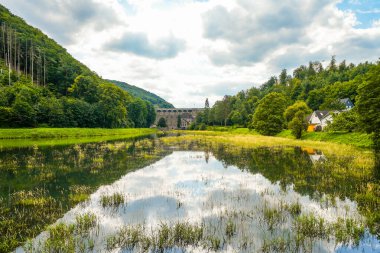 Reservoir on the dam wall at Diemelsee and the surrounding landscape. Nature at the Diemel Dam in the Sauerland.
