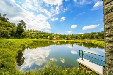 Reservoir on the dam wall at Diemelsee and the surrounding landscape. Nature at the Diemel Dam in the Sauerland.
