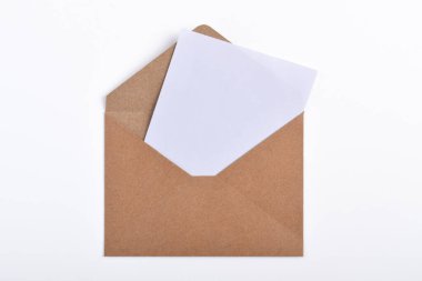 Opened brown paper envelope with paper sheet isolated on white background