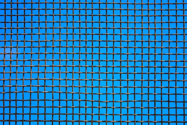 Photo Steel Mesh Wall Blue Sky Background — Stock Photo, Image