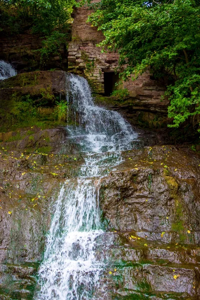 Photo of high waterfall in the mountains — Stock Photo, Image