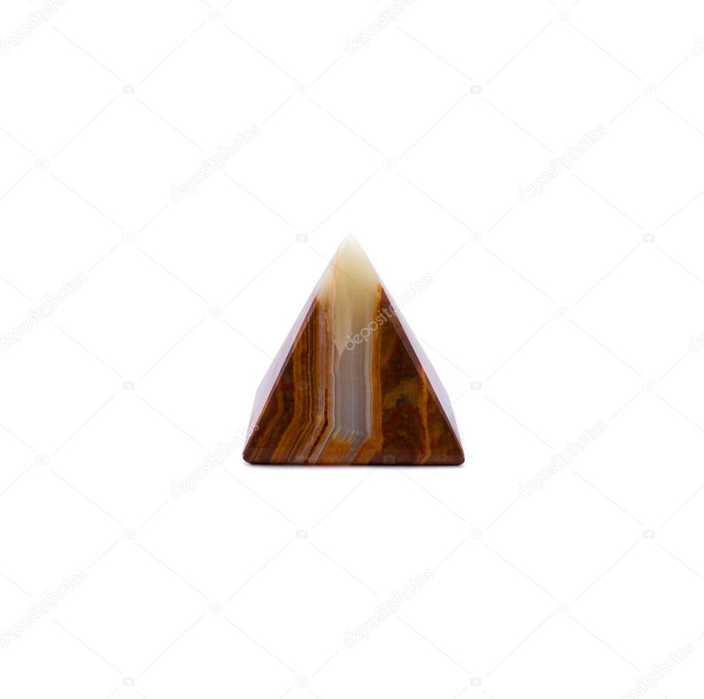 Photo of brown white onyx pyramid isolated on a white background