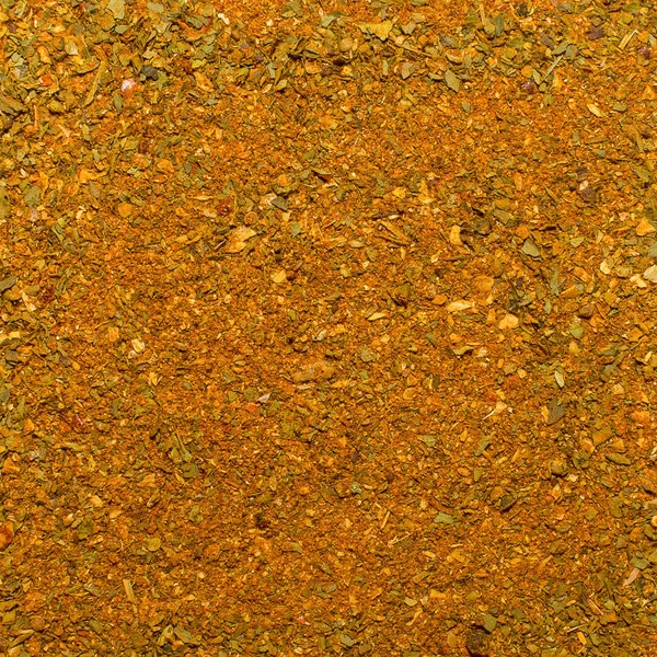 Foto de close up textura de especiarias de laranja para carne e frango e outros alimentos, fundo — Fotografia de Stock